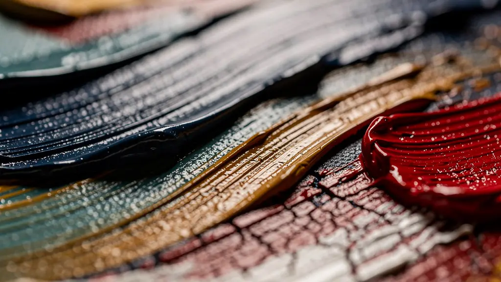 Extreme close-up of various painting tools creating different textures and marks on canvas